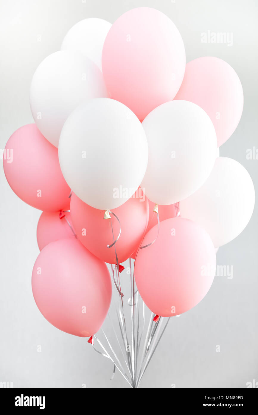 Colourful balloons, pink, white, streamers. Helium Ballon floating in  birthday party. Concept balloon of love and valentine Stock Photo - Alamy