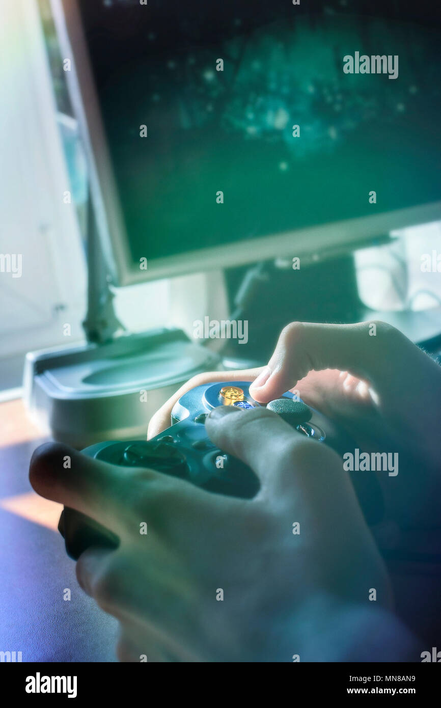 Close up of male hands holding a joystick Stock Photo