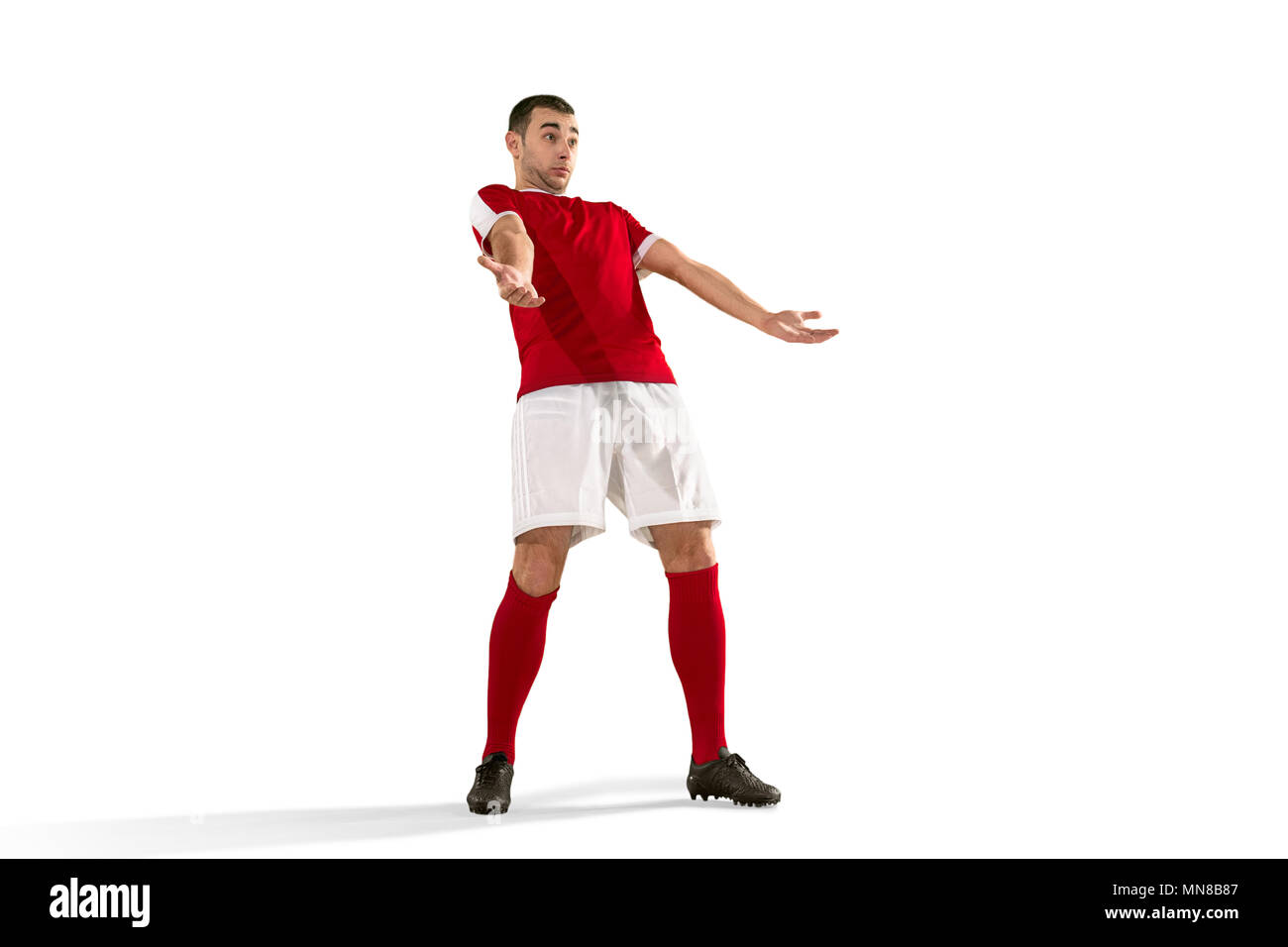 Professional football soccer player standing isolated white studio