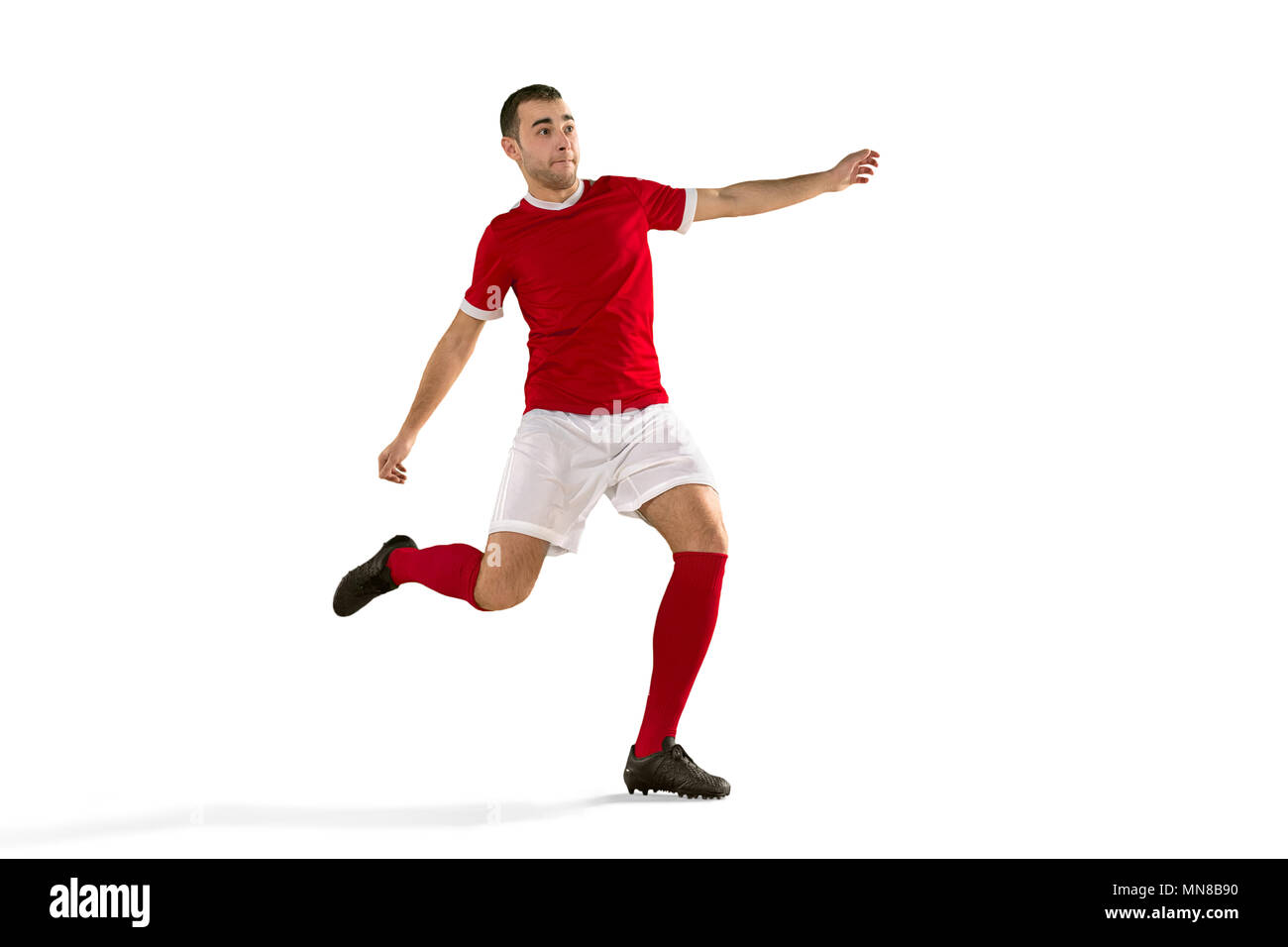 Professional football soccer player in motion isolated white studio
