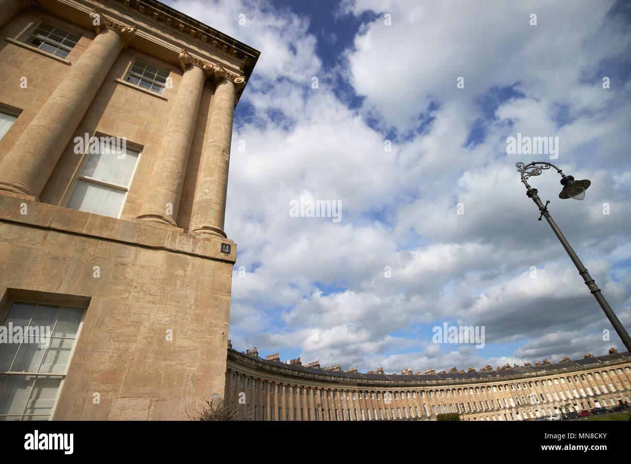 view of Royal Crescent residential road georgian houses Bath from the end house including columns and architectural detail street lamp England UK Stock Photo