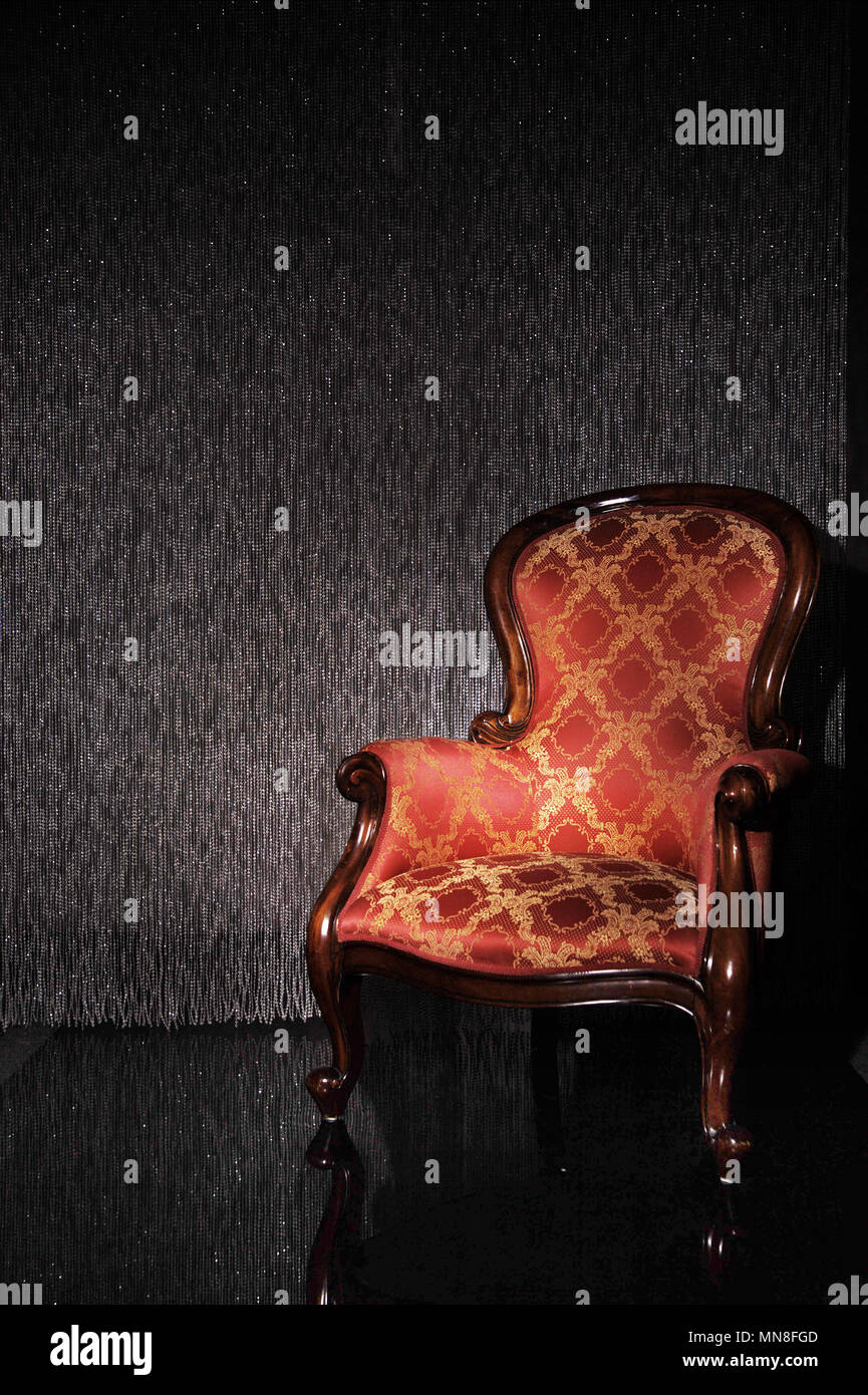 Old-fashioned armchair in the vintage interior Stock Photo - Alamy