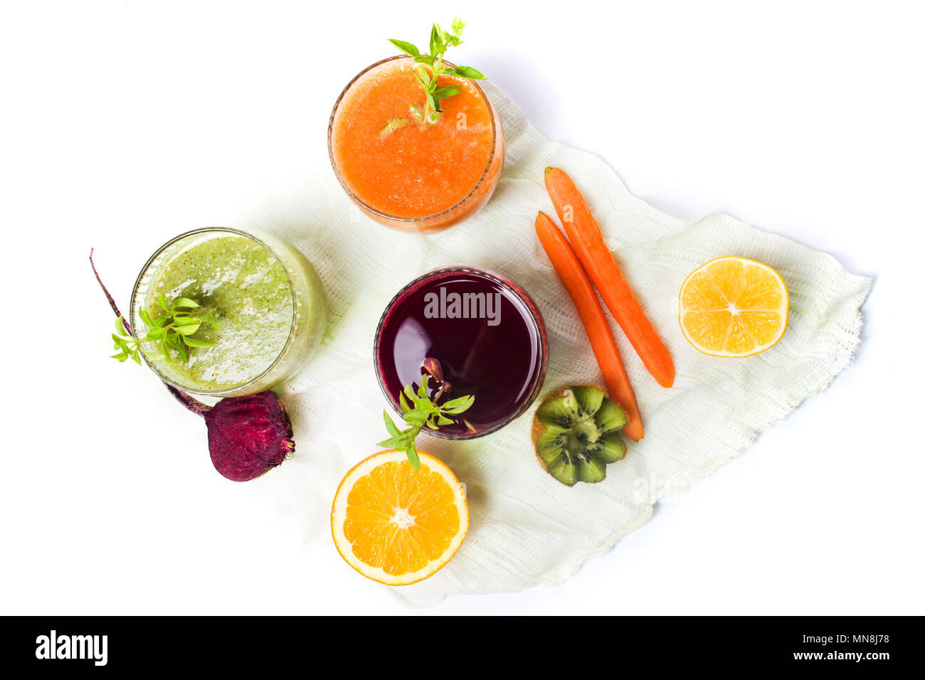 Kiwi beet and carrot smoothies in glasses isolated on white Stock Photo