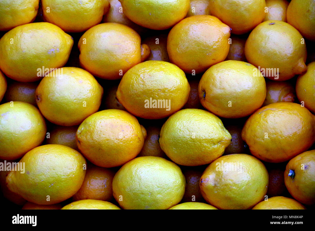 Group of fresh greek lemon from the marketplace. Healthy and full of vitamin C. Stock Photo