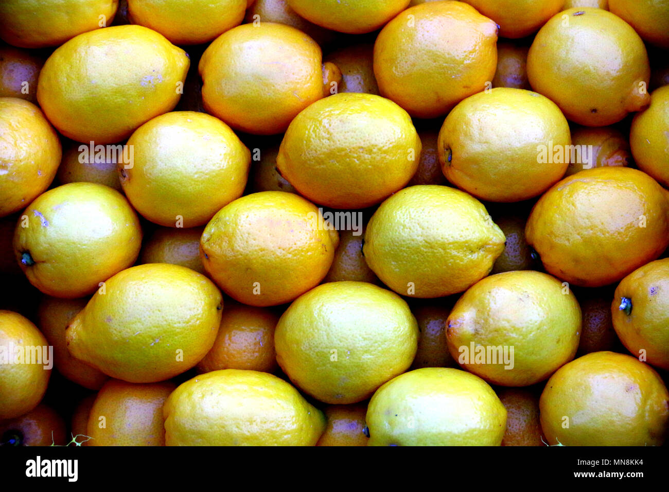 Group of fresh greek lemon from the marketplace. Healthy and full of vitamin C. Stock Photo