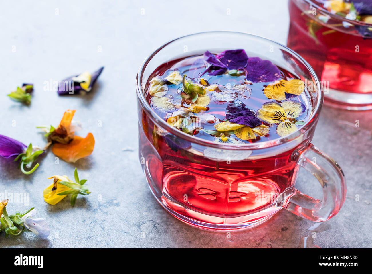Red Herbal Tea with Edible Flowers. Organic Beverage Stock Photo Alamy
