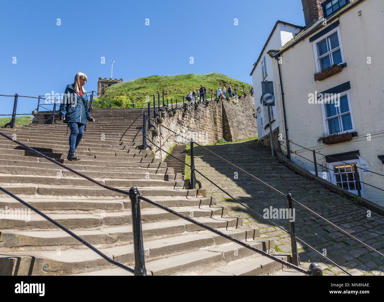 People using the 199 steps at Whitby, North Yorkshire, England, UK ...