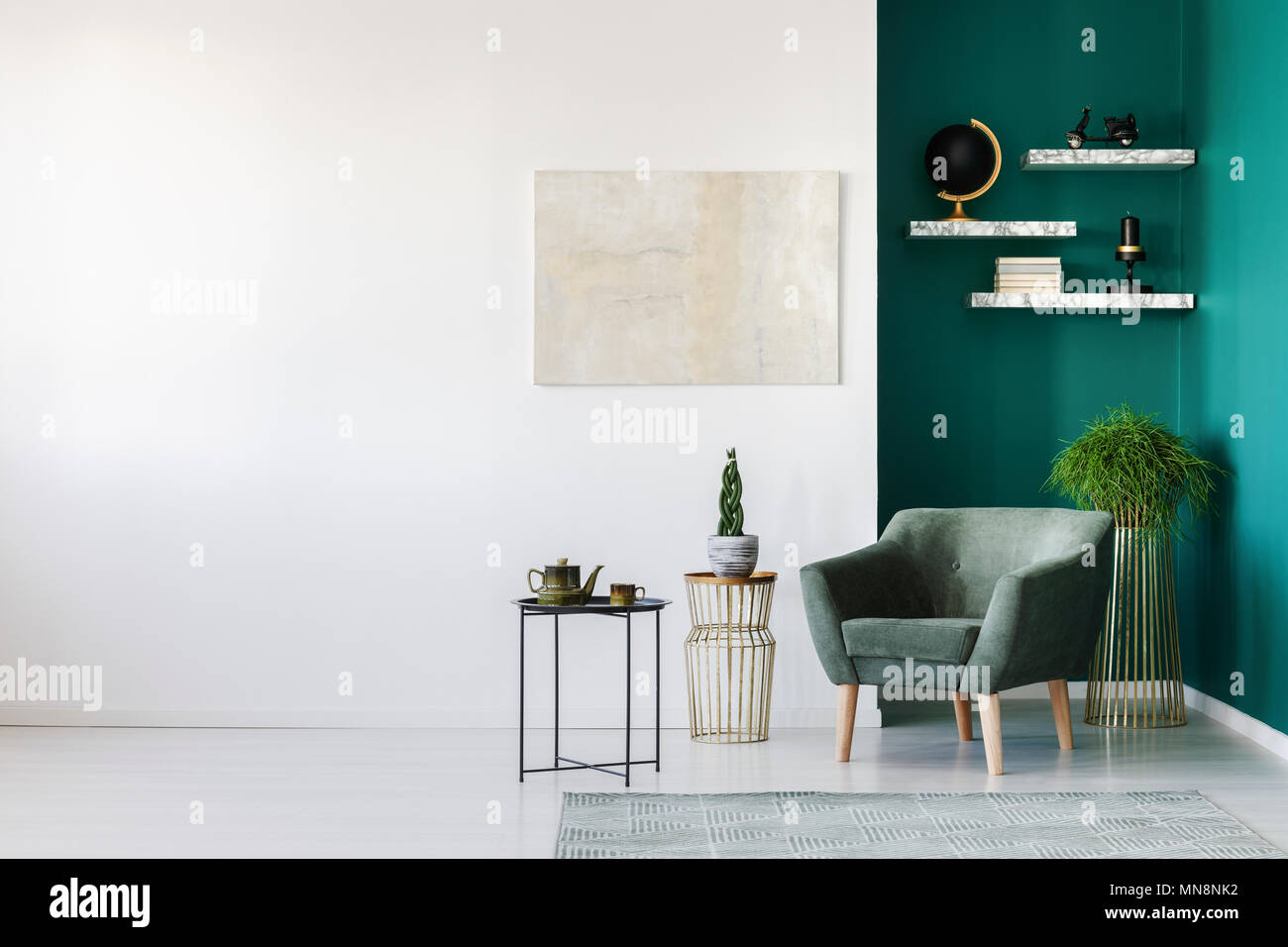 White and green living room interior with armchair, plants, teapot set
