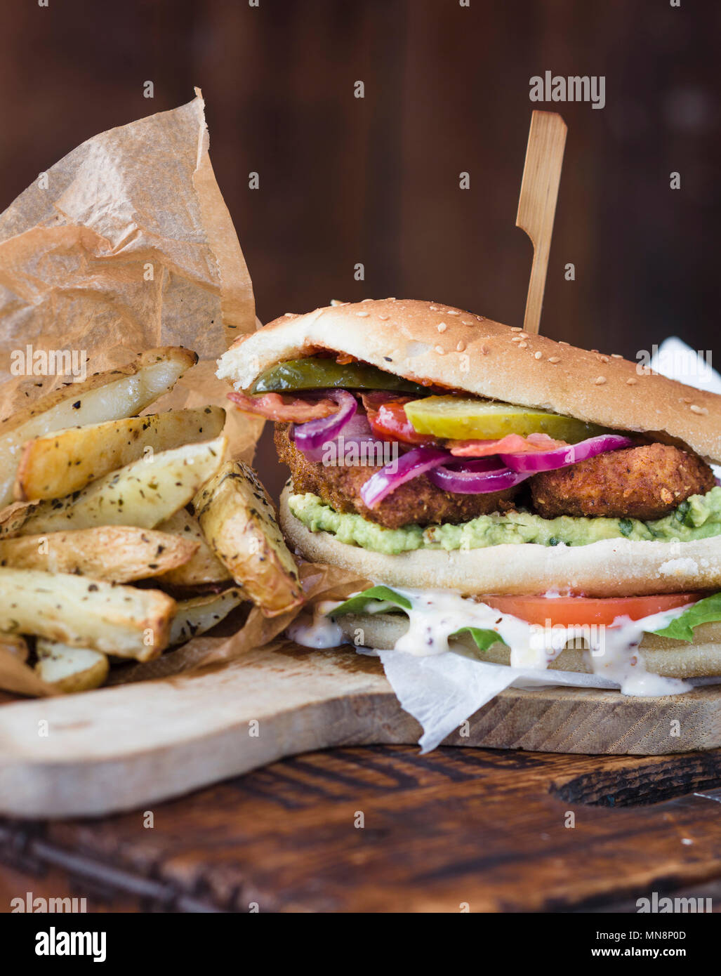 Chicken Escalope sandwich with salad and homemade oven chips Stock Photo