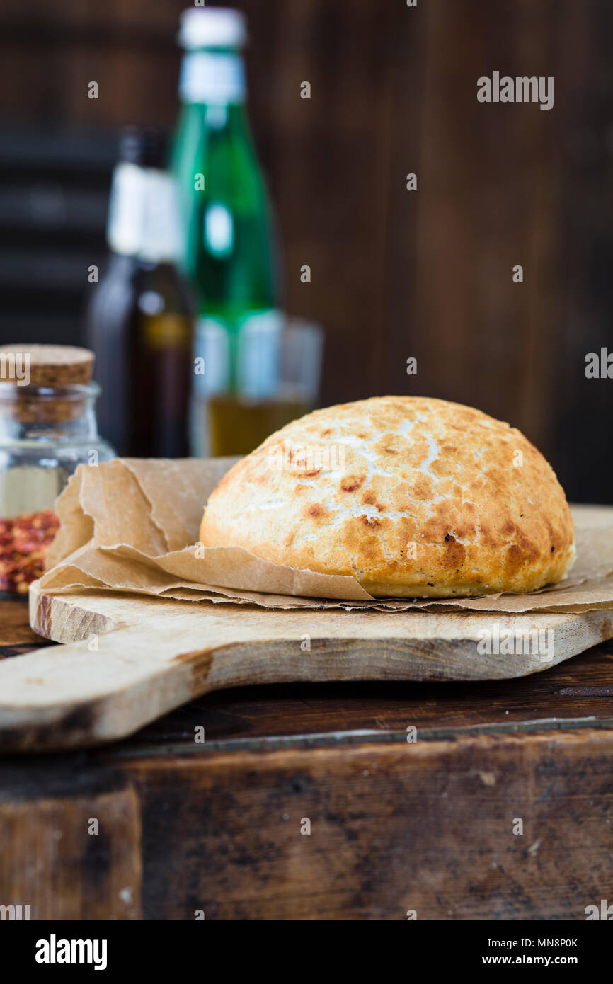 Bread on a serving board Stock Photo