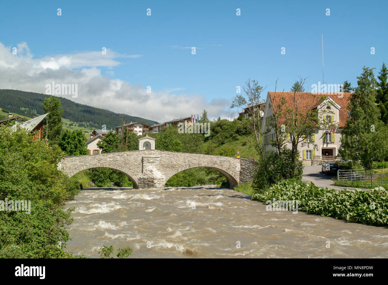 View on the historic bridge over the river Julia in Savognin Stock Photo