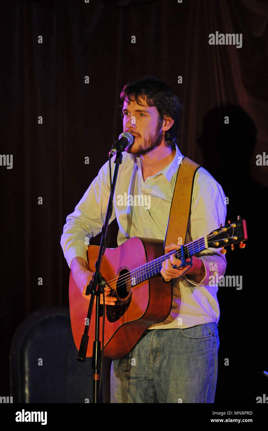 Malachy Tallack singer songwriter writer and author onstage playing in Shetland Stock Photo