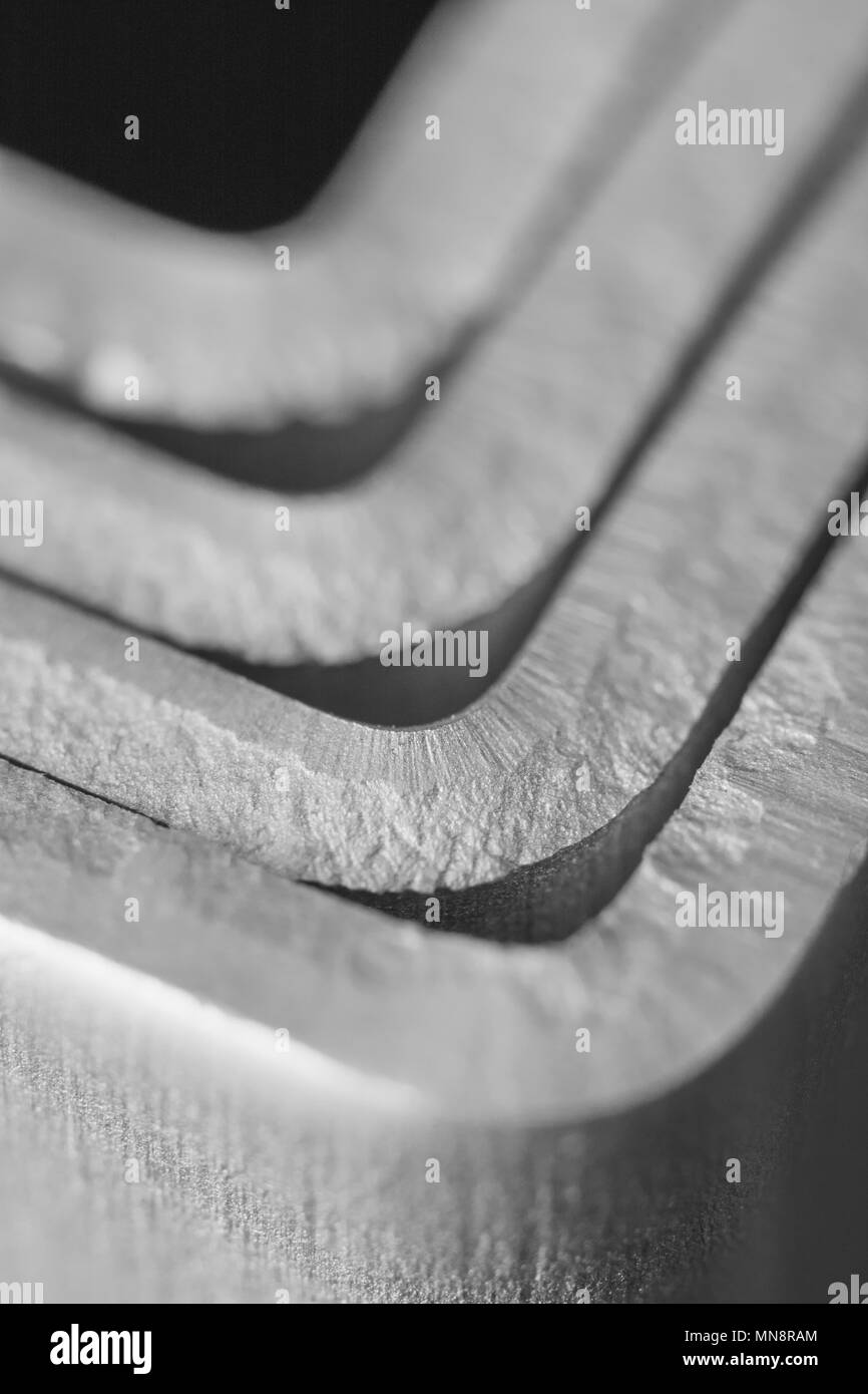 Macro close-up of some aluminium bracket parts. Metaphor for metalwork, metal components. Stock Photo