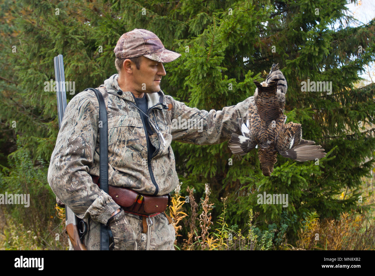 hunter with hunting trophy - black grouse Stock Photo