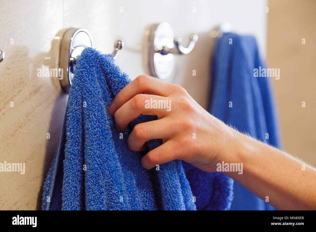 https://c8.alamy.com/comp/MN8XEB/towel-for-hands-hanging-on-a-rack-in-the-bathroom-MN8XEB.jpg