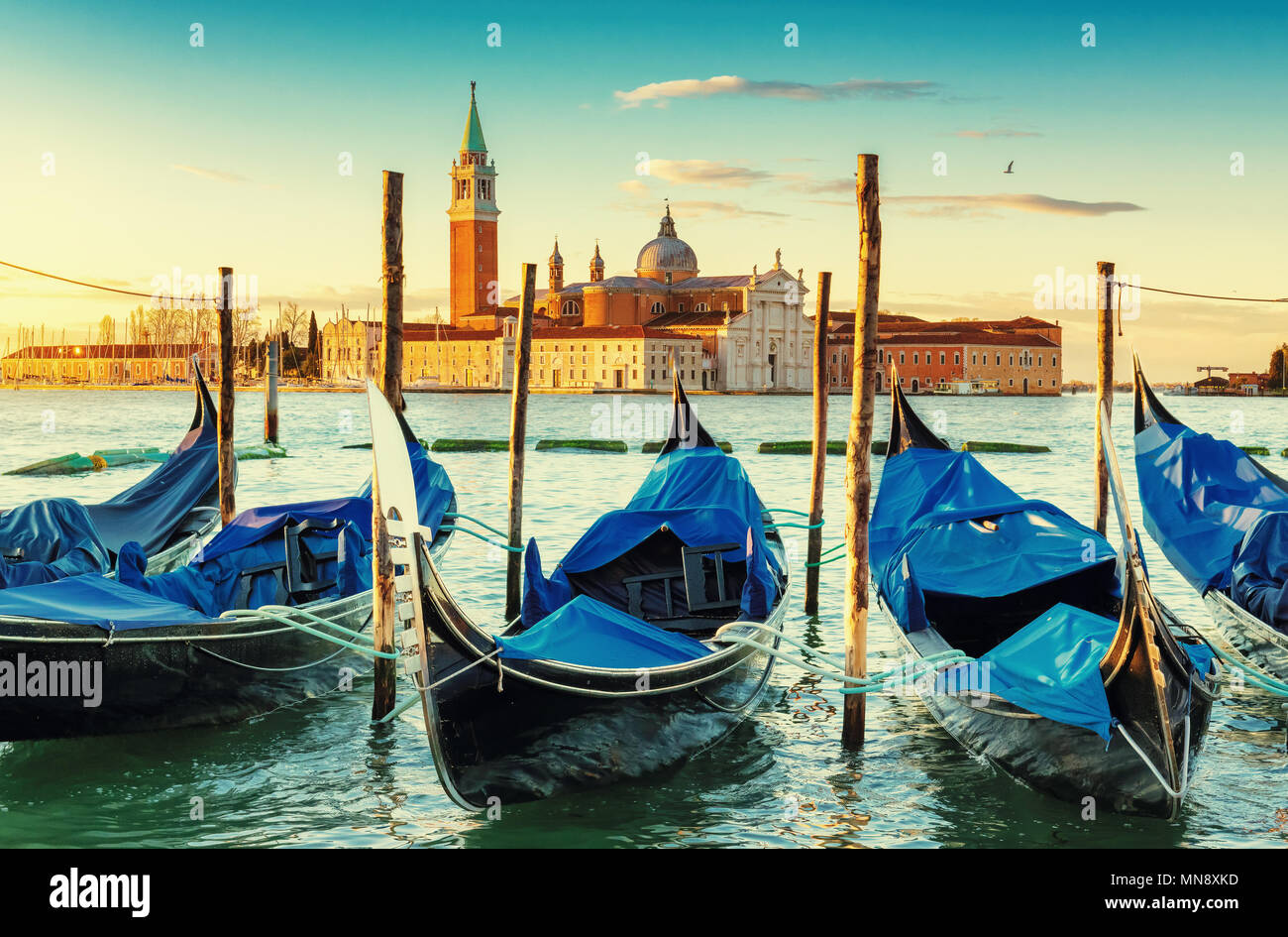 Venice gondolas near San Marco square at sunrise, Grand Canal, Venice, Italy. Vintage post processed. Stock Photo