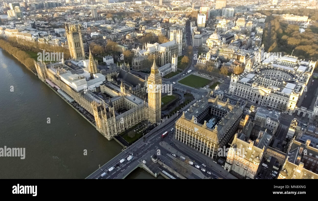 London Aerial Cityscape with Landmarks including the Thames, Big Ben Clock Tower and Parliament Palace, Portcullis House and Westminster Square Garden Stock Photo
