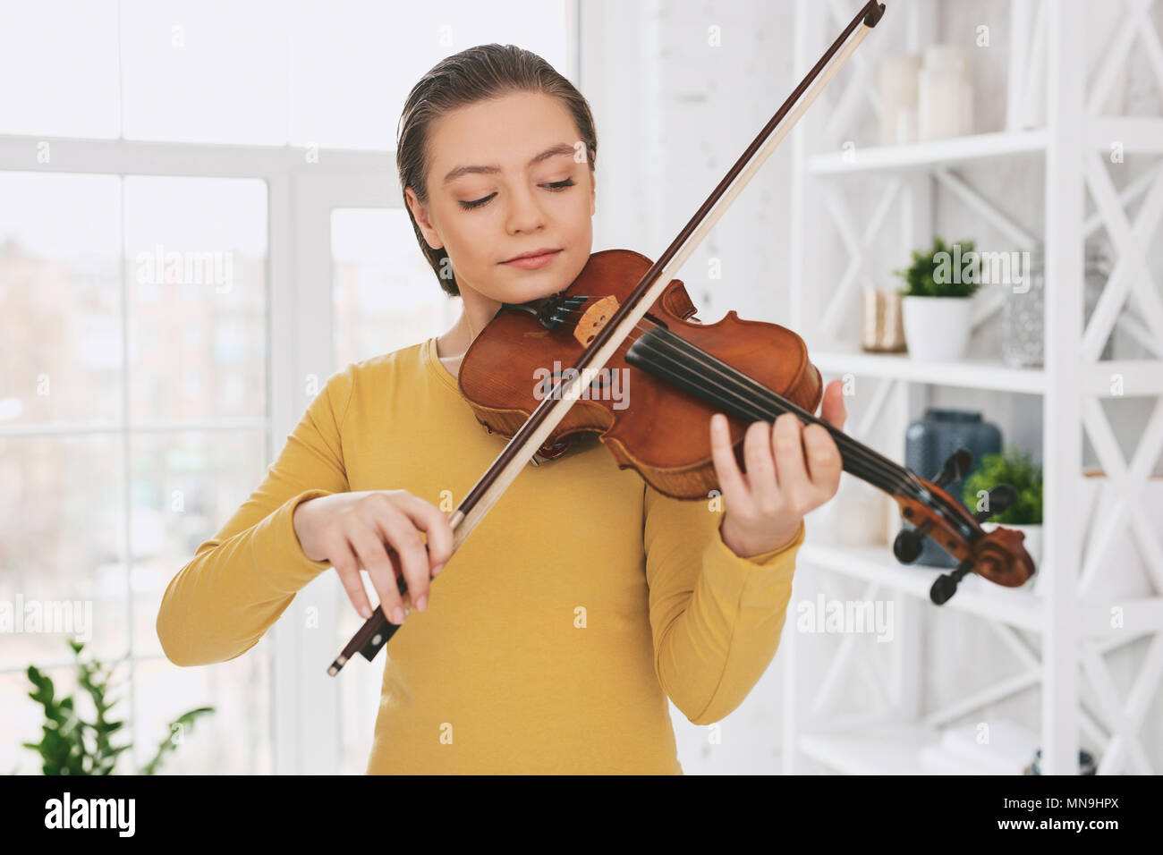 Concentrated girl repeating her performance Stock Photo - Alamy