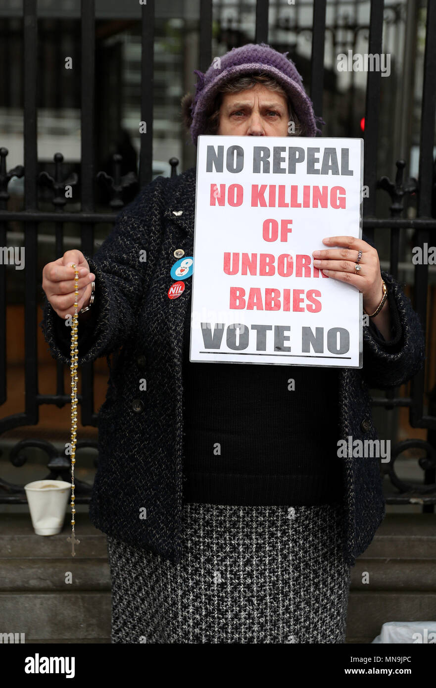 Anti-abortion campaigners pray outside Leinster House, Dublin, ahead of the referendum on the 8th Amendment of the Irish Constitution on May 25th. Stock Photo