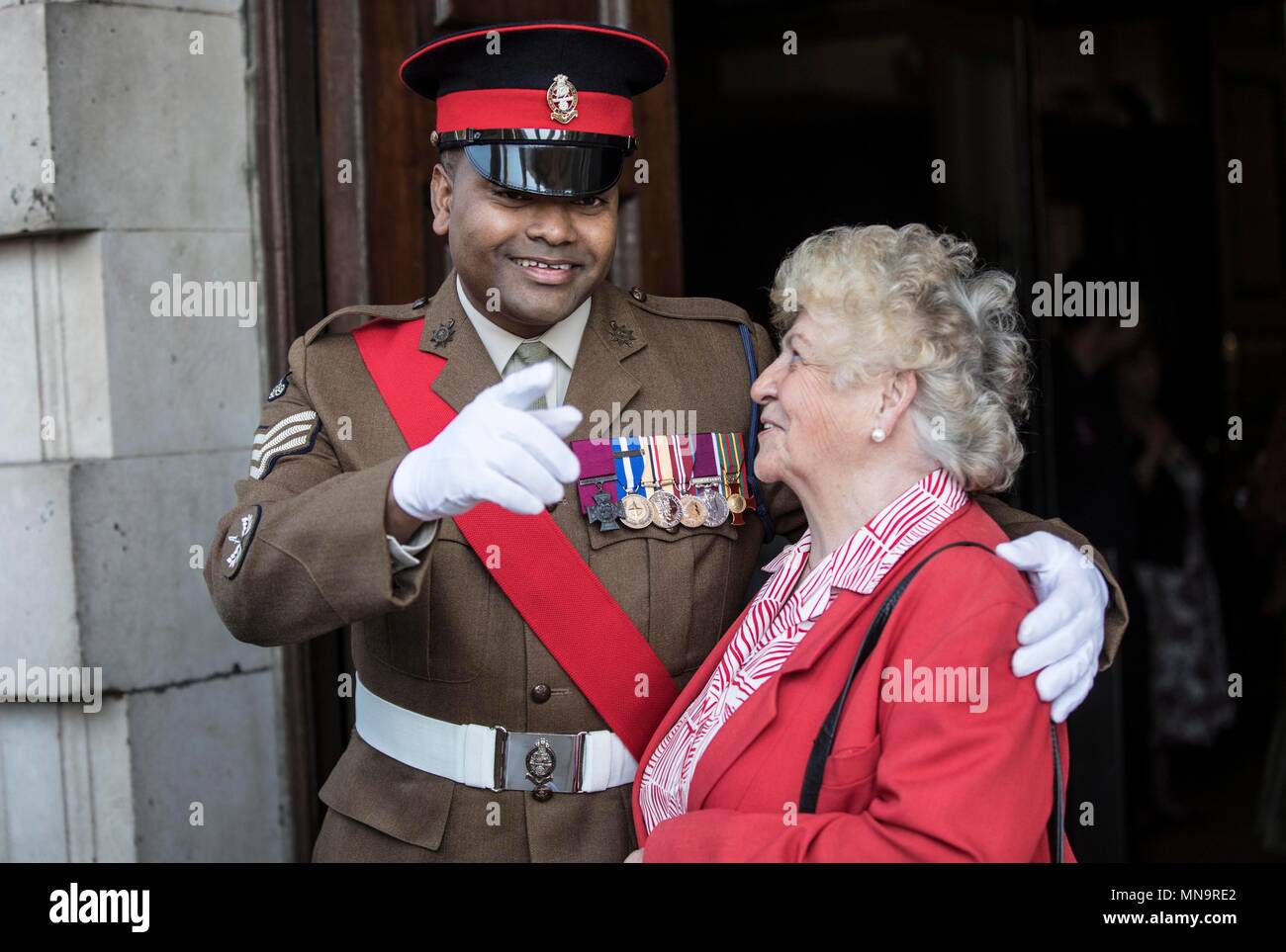 Victoria Cross recipient Johnson Beharry greets guest Cynthia Rolfe at