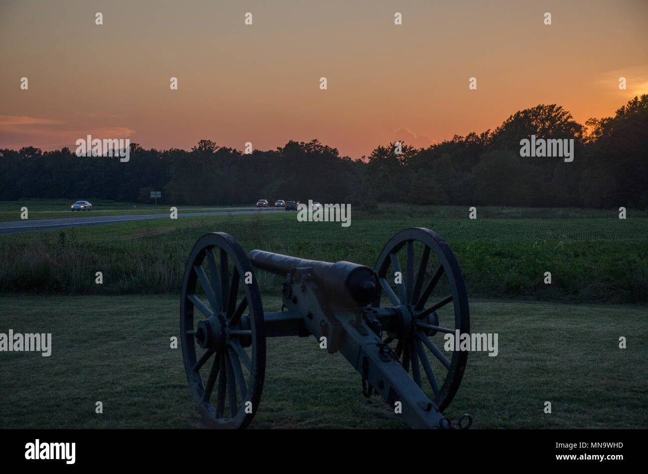 Sun sets over a Civil War era cannon at the Chancellorsville battlefield near Fredericksburg, Virginia. Stock Photo