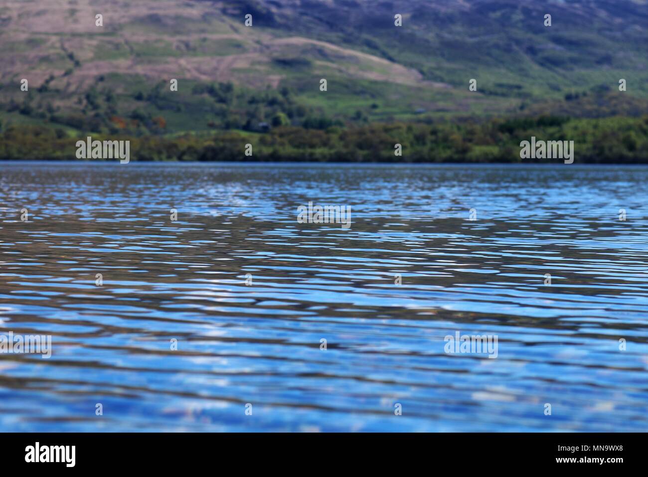Beautiful Loch Lomond, Scotland, UK on a clear sunny day showing water and mountains in a breath-taking view. A popular tourist attraction and holiday Stock Photo