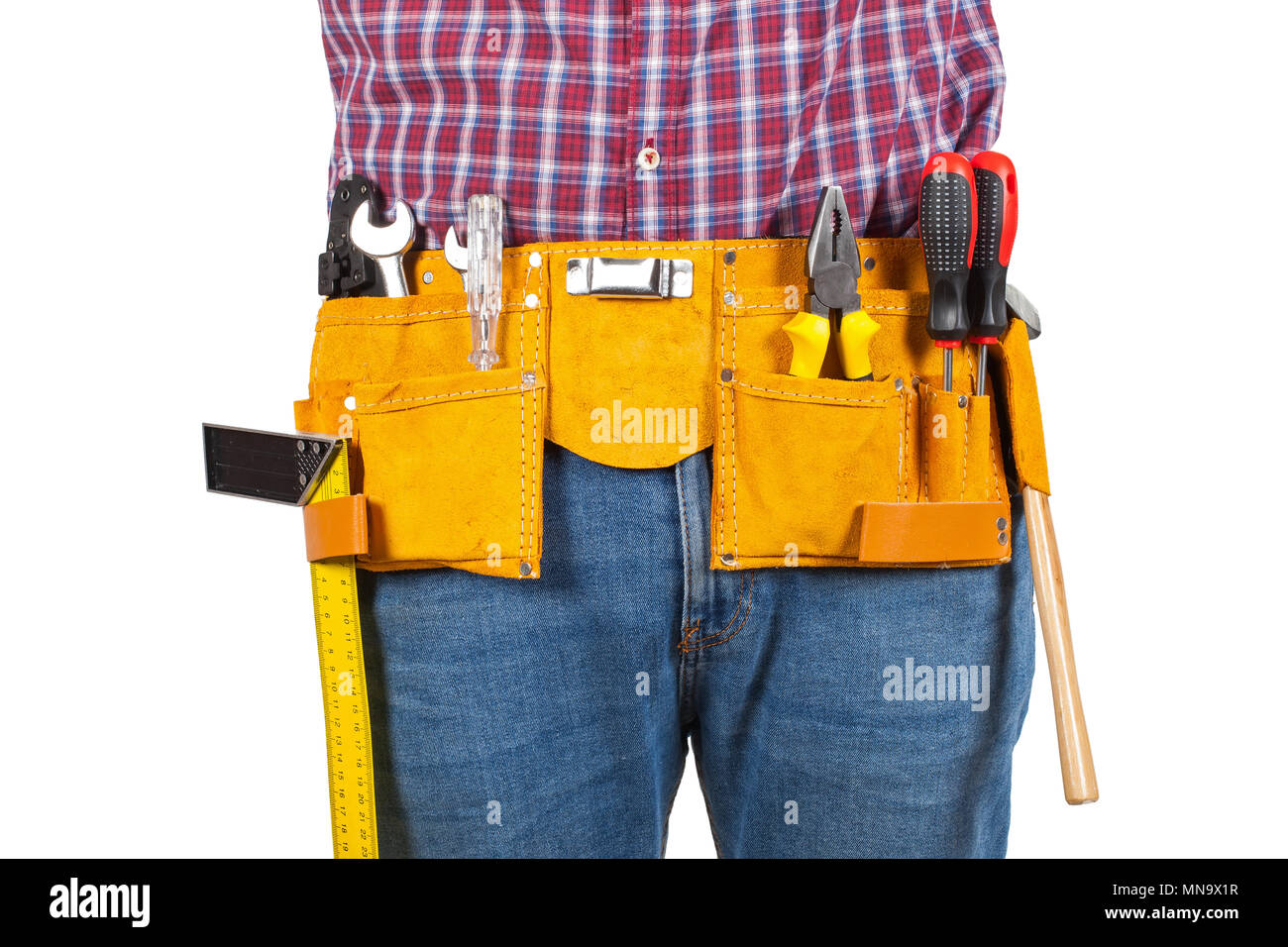 Close up picture of young handyman's yellow tool belt on isolated background Stock Photo