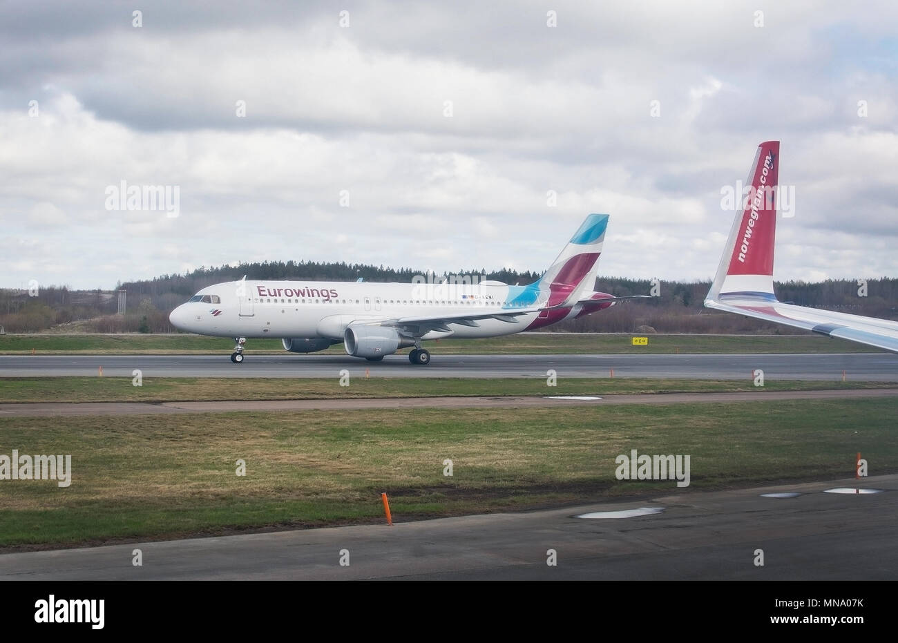 STOCKHOLM, SWEDEN - APRIL 27, 2018: Arlanda airport tarmac and Eurowings aircraft leaving Stock Photo