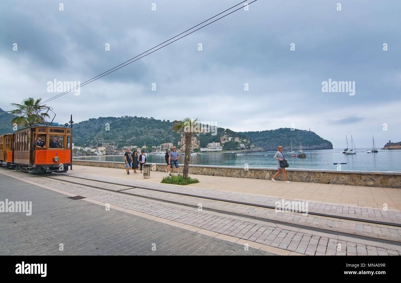 PUERTO SOLLER, MALLORCA, SPAIN - MAY 10, 2018: Tram in the marina on an overcast day on May 10, 2018 in Puerto Soller, Mallorca, Spain. Stock Photo
