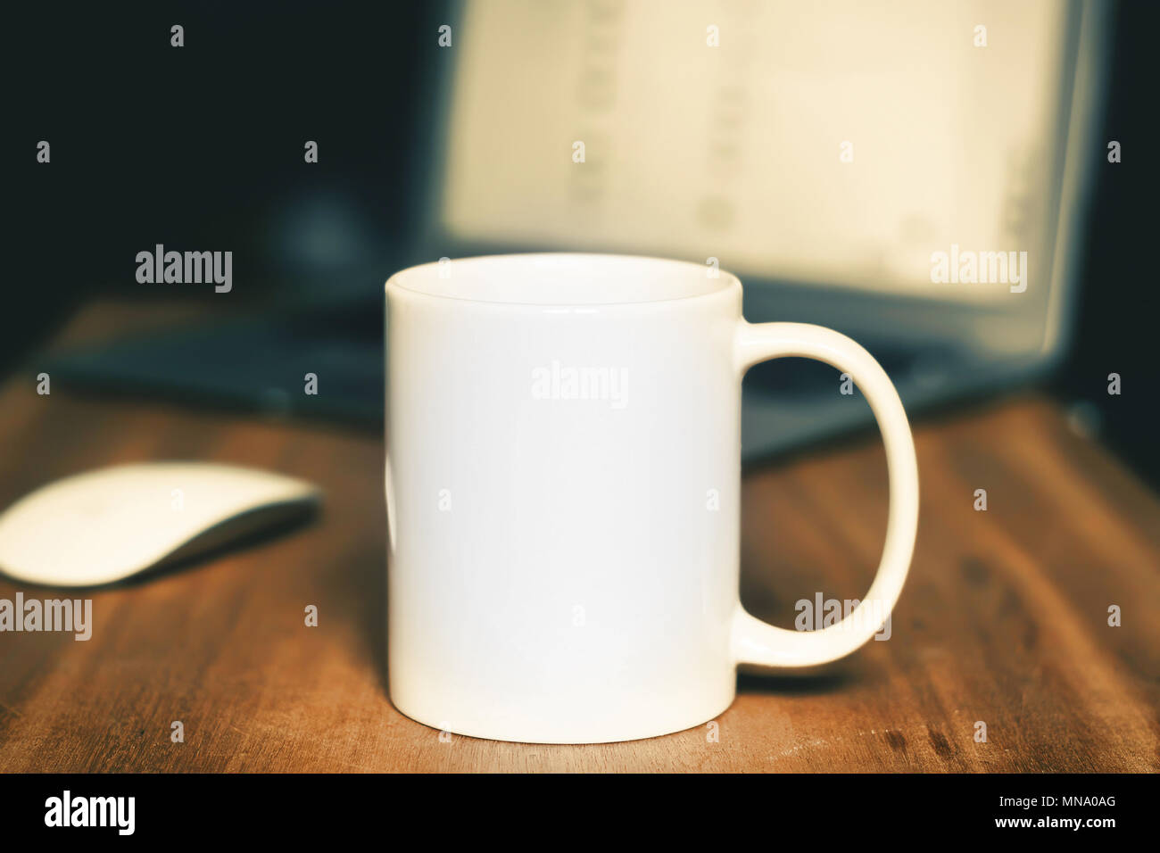 White mug on the wooden table. Soft background Stock Photo