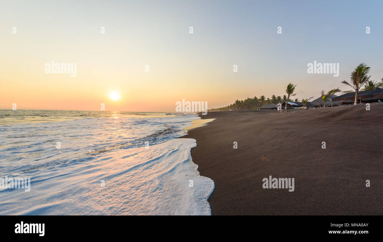 Sunset at Beach with Black Sand in Monterrico, Guatemala. Monterrico is situated on the Pacific coast in the department of Santa Rosa. Known for its v Stock Photo