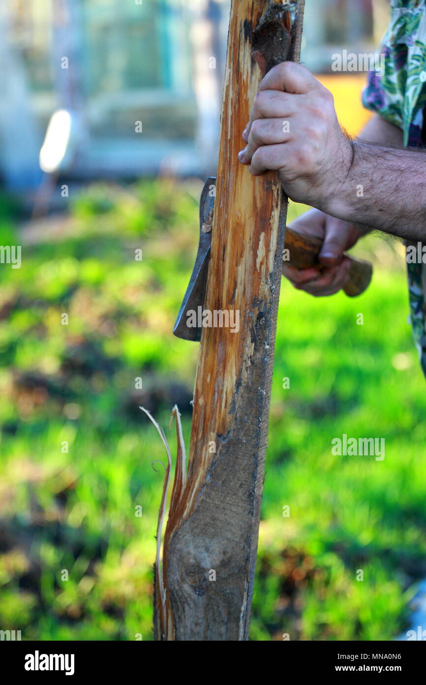 Men's hands make an axe cut on the Board Stock Photo Alamy
