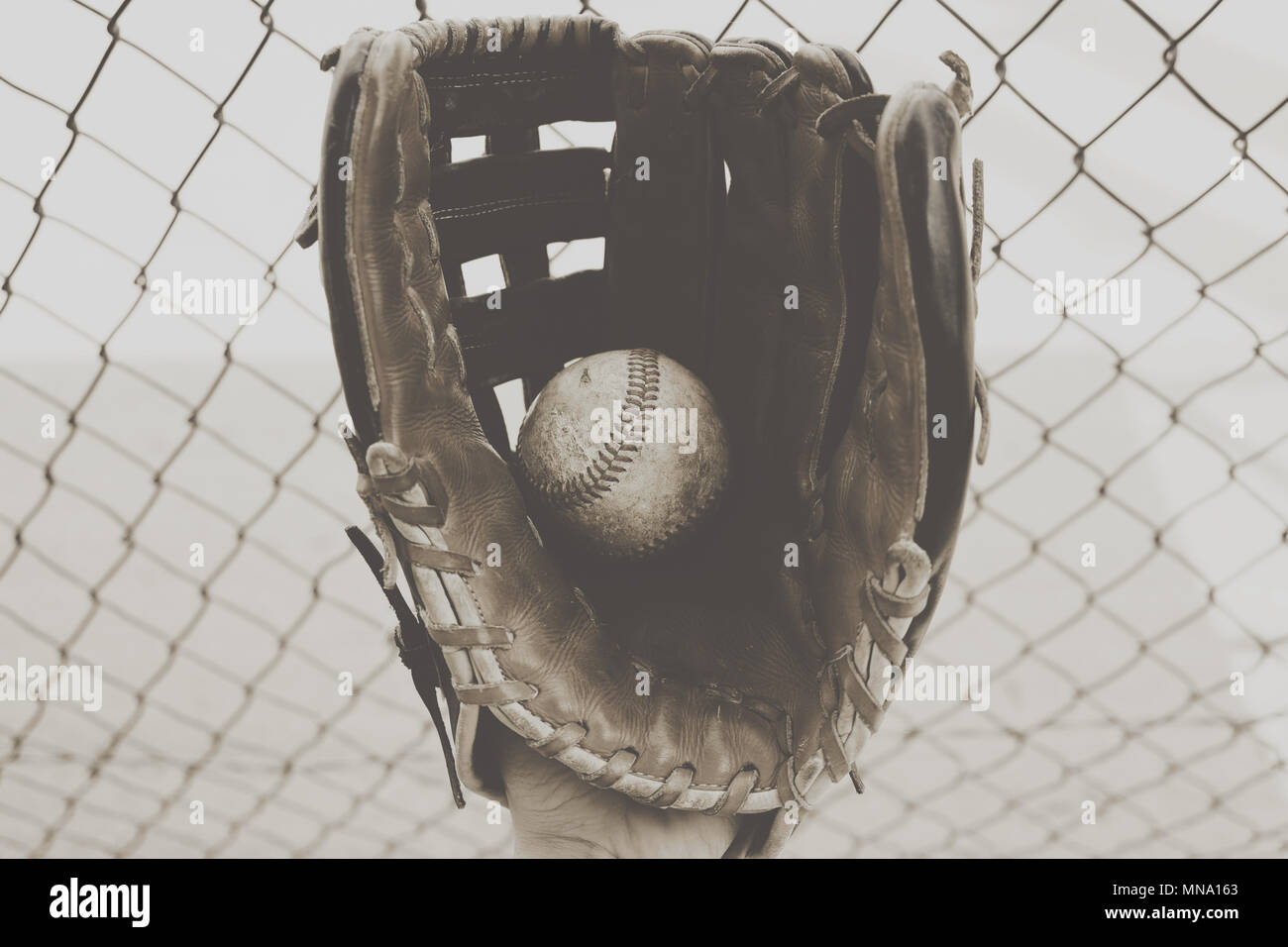 Rough vintage baseball in mitt Stock Photo Alamy
