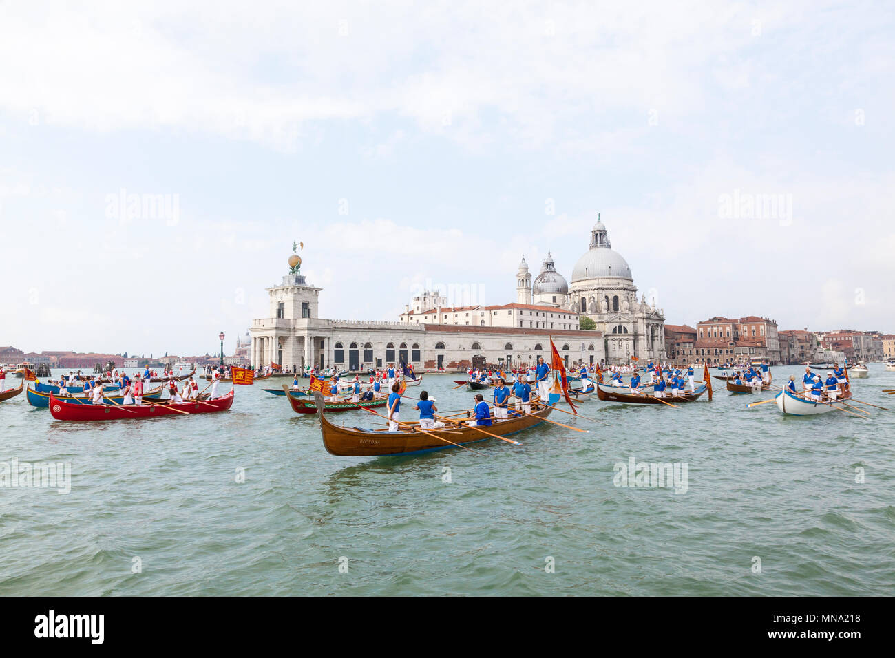 Boats gathering in front of Punta della Dogana for the Festa de la Sensa corteo, Venice, Italy to renew Venice's Marriage to the Sea ceremony Stock Photo