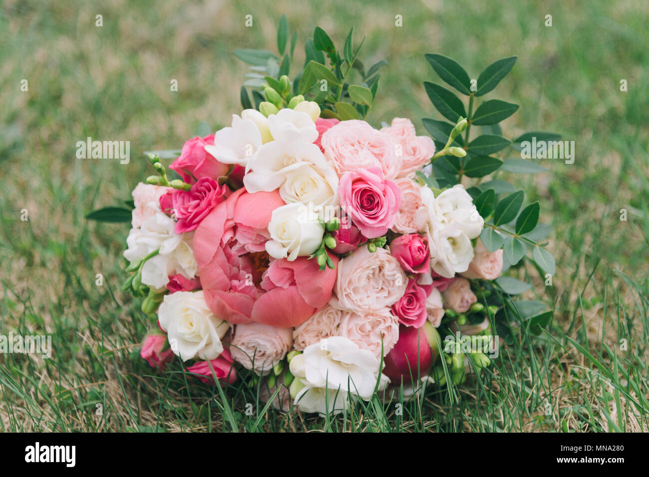 Bouquet of flowers. The bride's bouquet. Bridal bouquet. Floristics. Wedding bouquet from different colors. Stock Photo