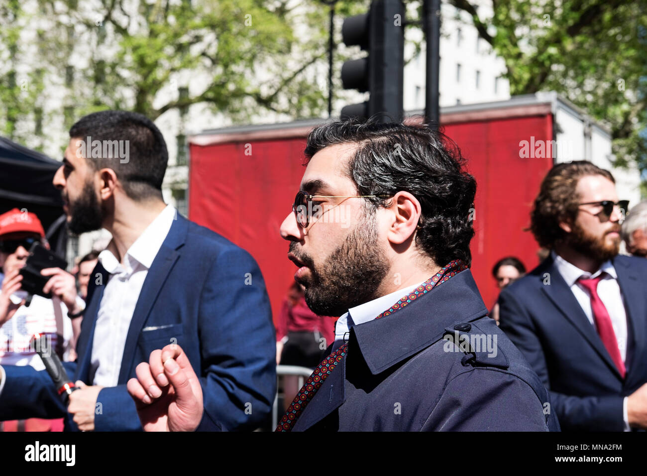 Raheem Kassam speaks with Muslim protesters at the Day for Freedom event in Whitehall. Raheem Kassam is the head of Breitbart media UK and considered by many to be a right wing journalist.  The Day for Freedom rally was organised by Tommy Robinson and members of his team. The event was arranged by Mr Robinson's team in response to a culmination of events which they perceived as having impacted their freedom of speech. Within the UK there is a growing debate on what is freedom of speech and what is hate speech, and if both can coexist. Stock Photo