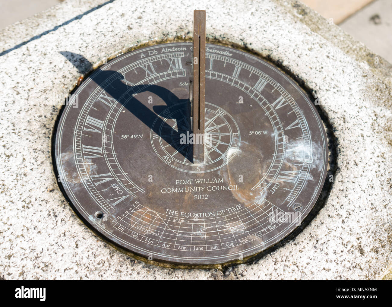 Sundial with slotted gnomon and equation of time Stock Photo
