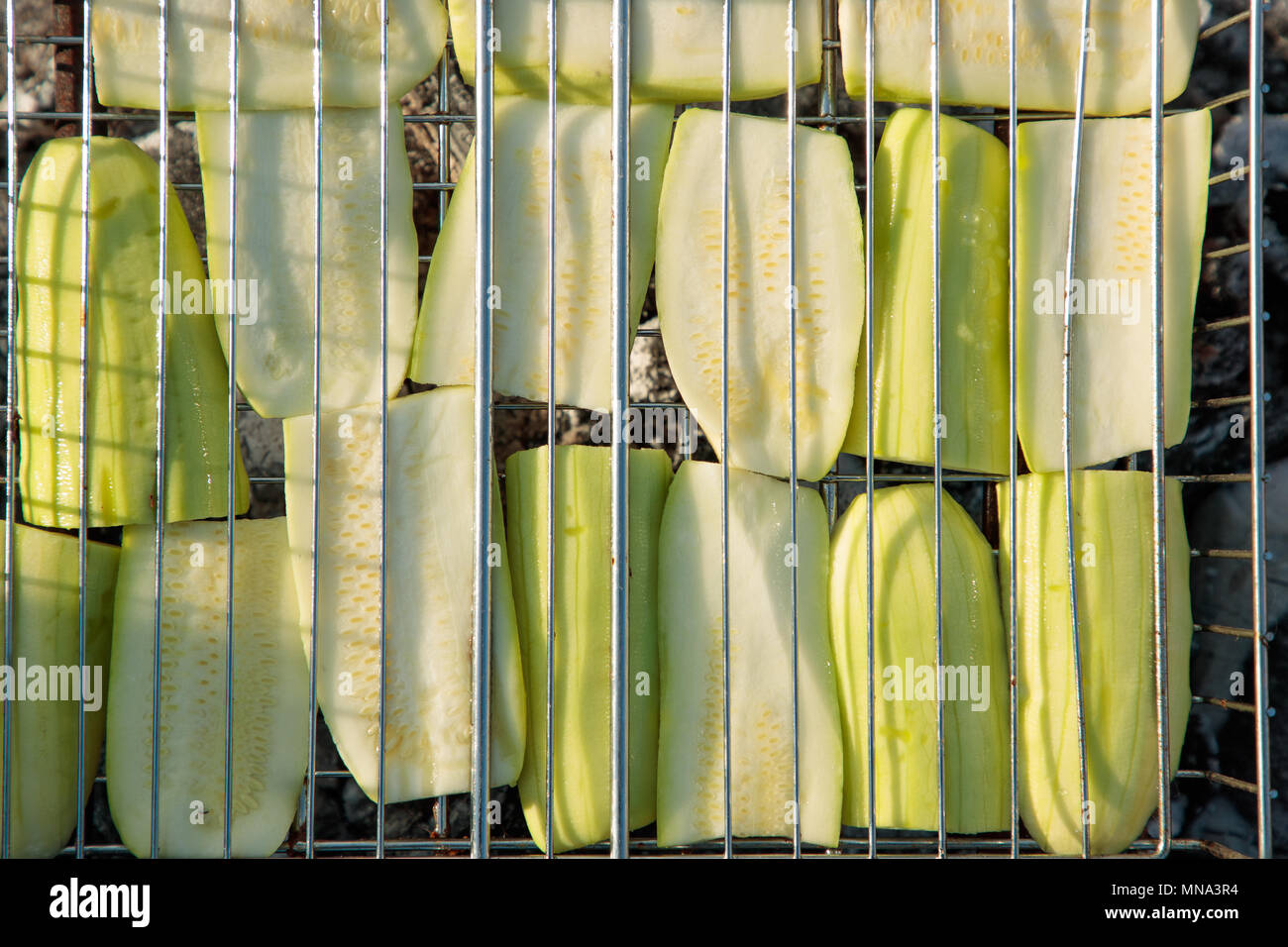 cut zucchini are cooked on the grill Stock Photo - Alamy