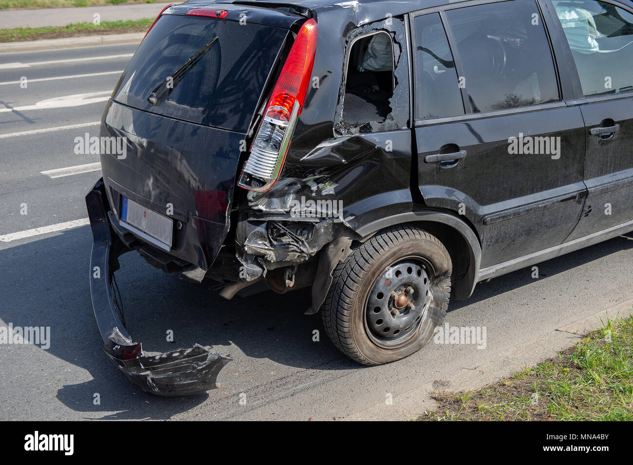 car crash accident on street, damaged automobile after collision in city Stock Photo