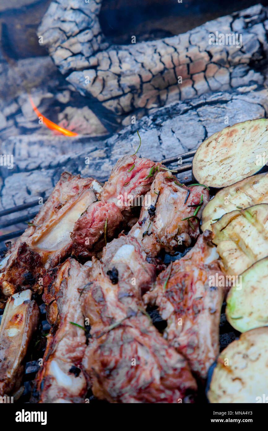 Barbecue with wood, pork ribs and eggplant slices Stock Photo Alamy