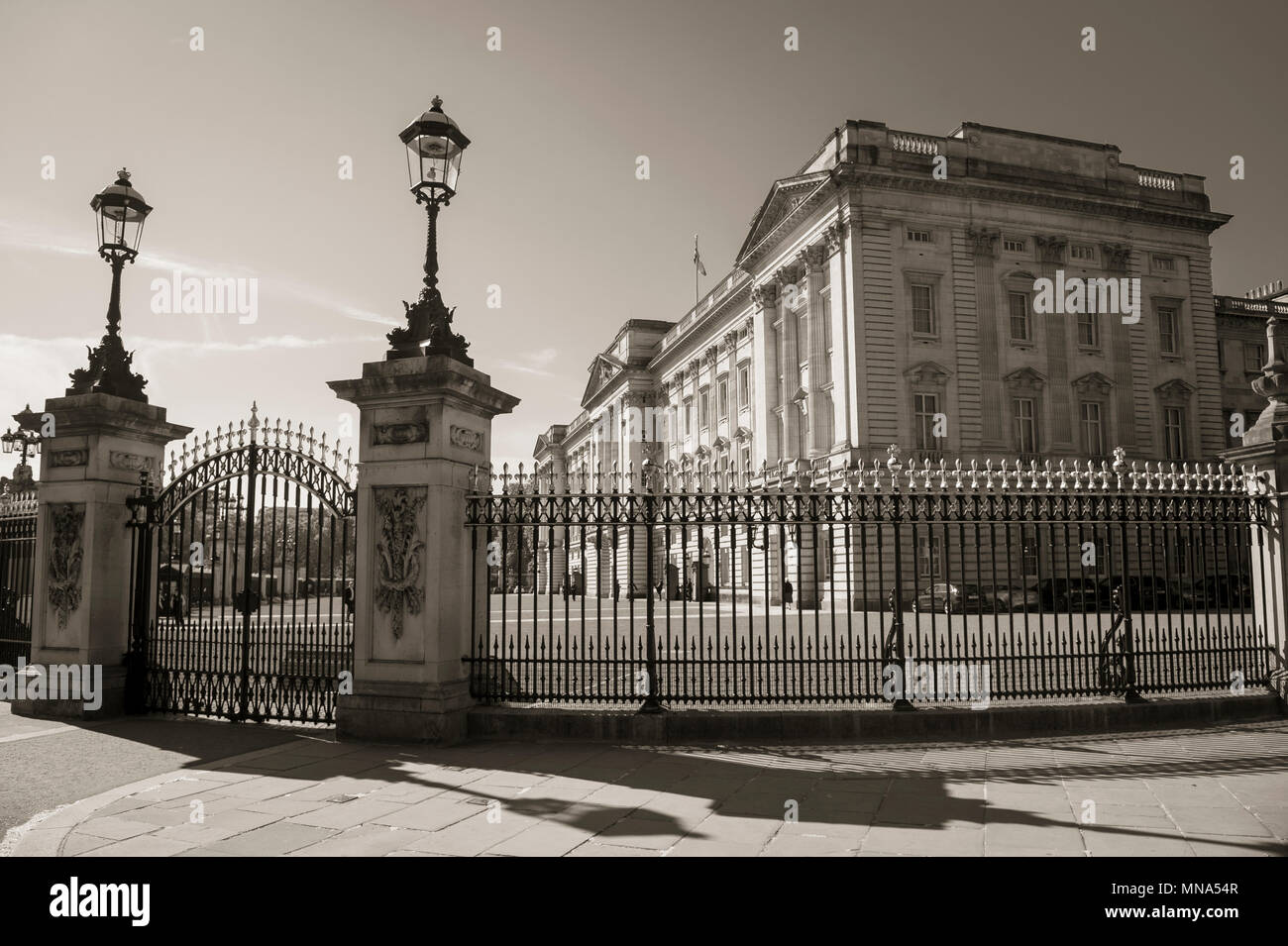 LONDON - MAY 15, 2018: Black and White image of Buckingham Palace behind ornate fence and gates. Stock Photo