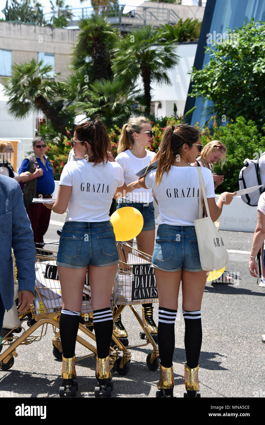 Cannes, France - May 11, 2018:  Grazia employees distributing the magazine to the crowd at the 71st  Cannes Film Festival. Stock Photo