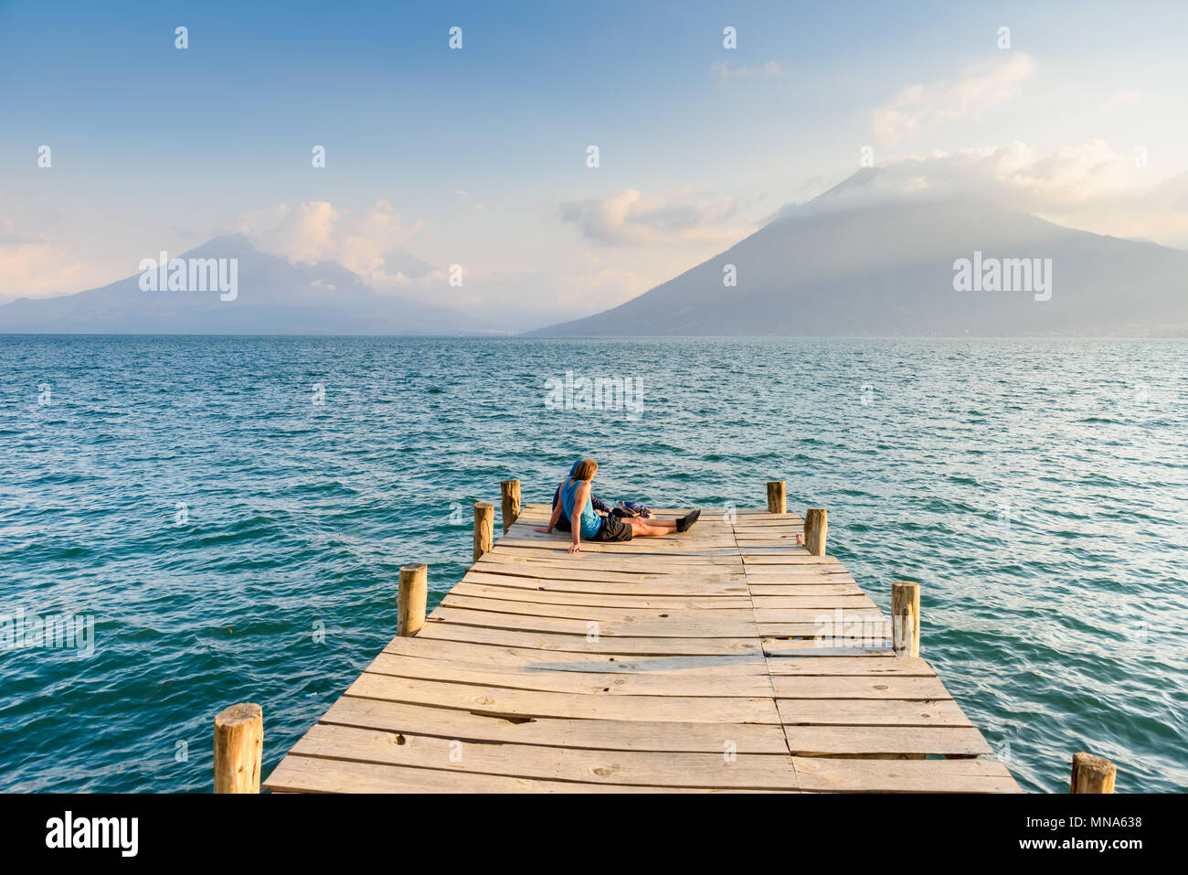 Pier at San Marcos La Laguna with beaufiful scenery of Lake Atitlan and volcanos - Guatemala Stock Photo