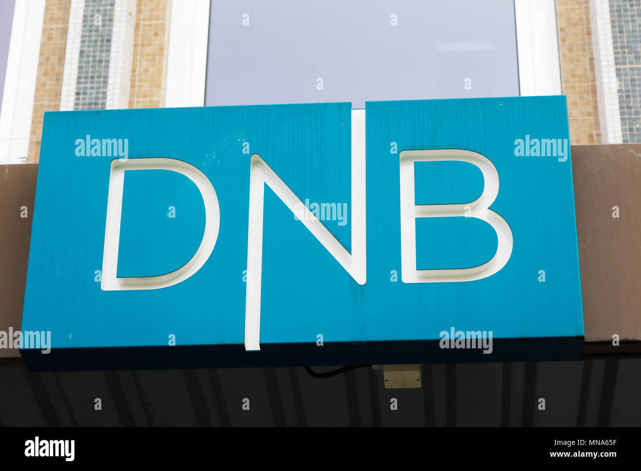 Trondheim, Norway - September 26, 2015: Close-up of the sign at the DNB office entrance. DNB is a Norwegian financial services group. Stock Photo
