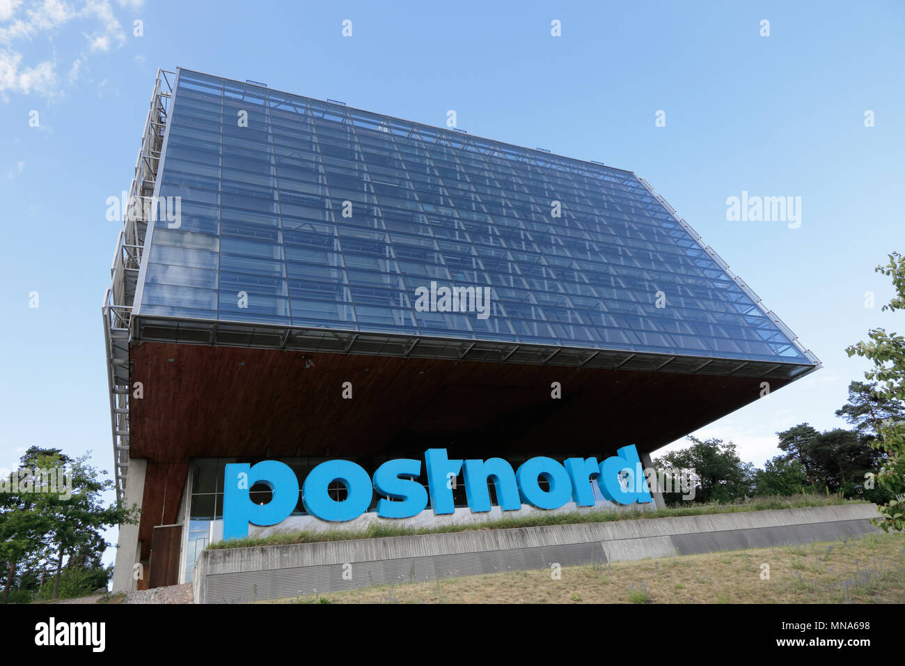Solna, Sweden - June 27, 2016: The exterior of the Swedish postal service Postnord modern head office building located in Tomteboda. Stock Photo