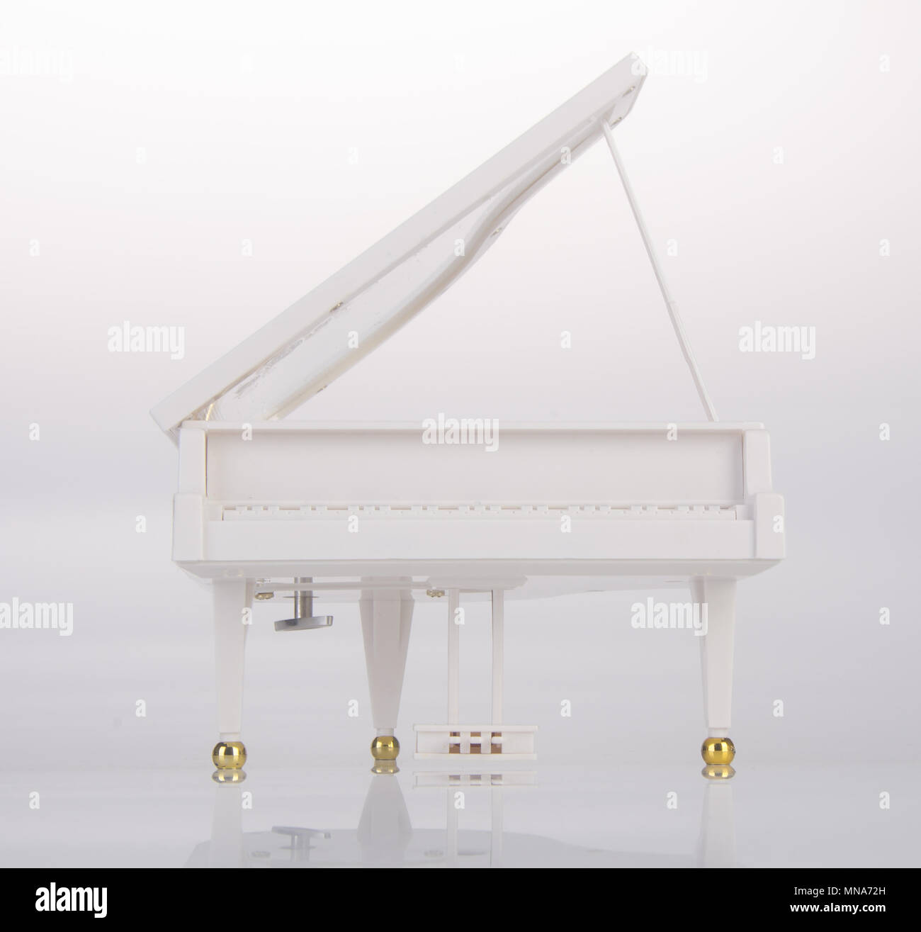 toy or toy grand piano on a background Stock Photo - Alamy