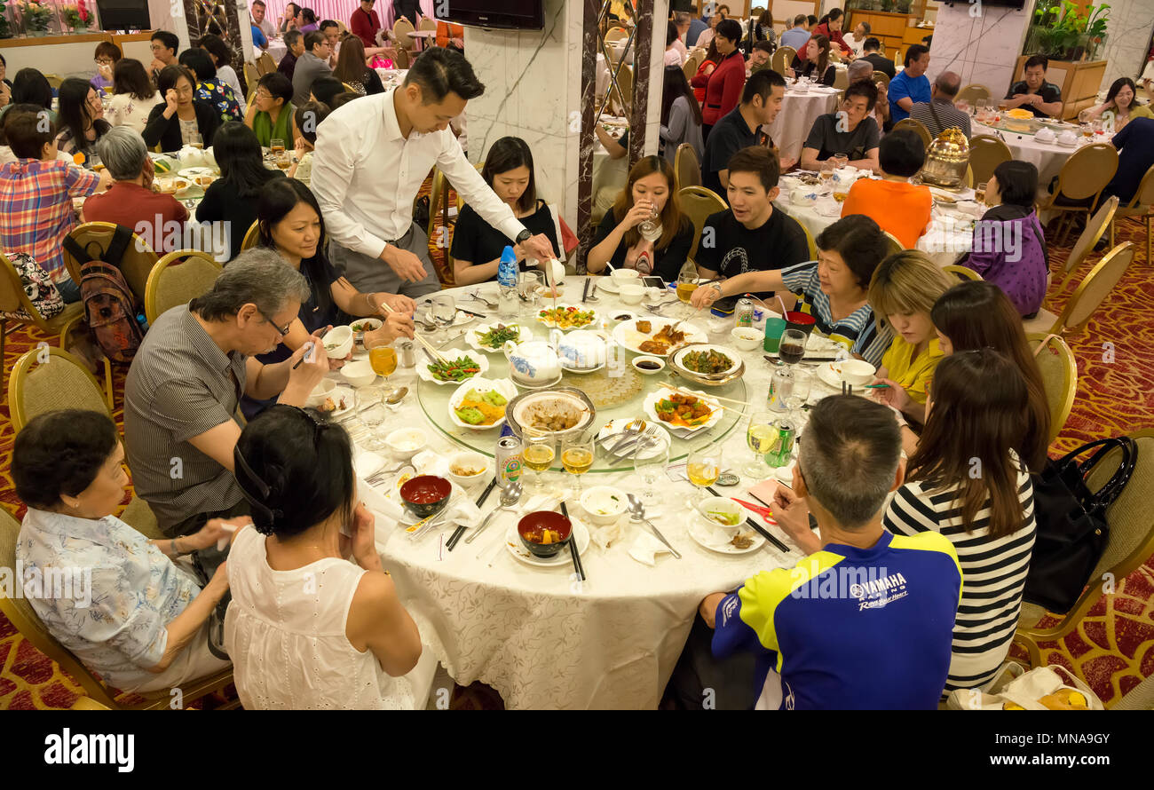 Chinese Family Having A Meal In A Chinese Restaurant Hong Kong China 