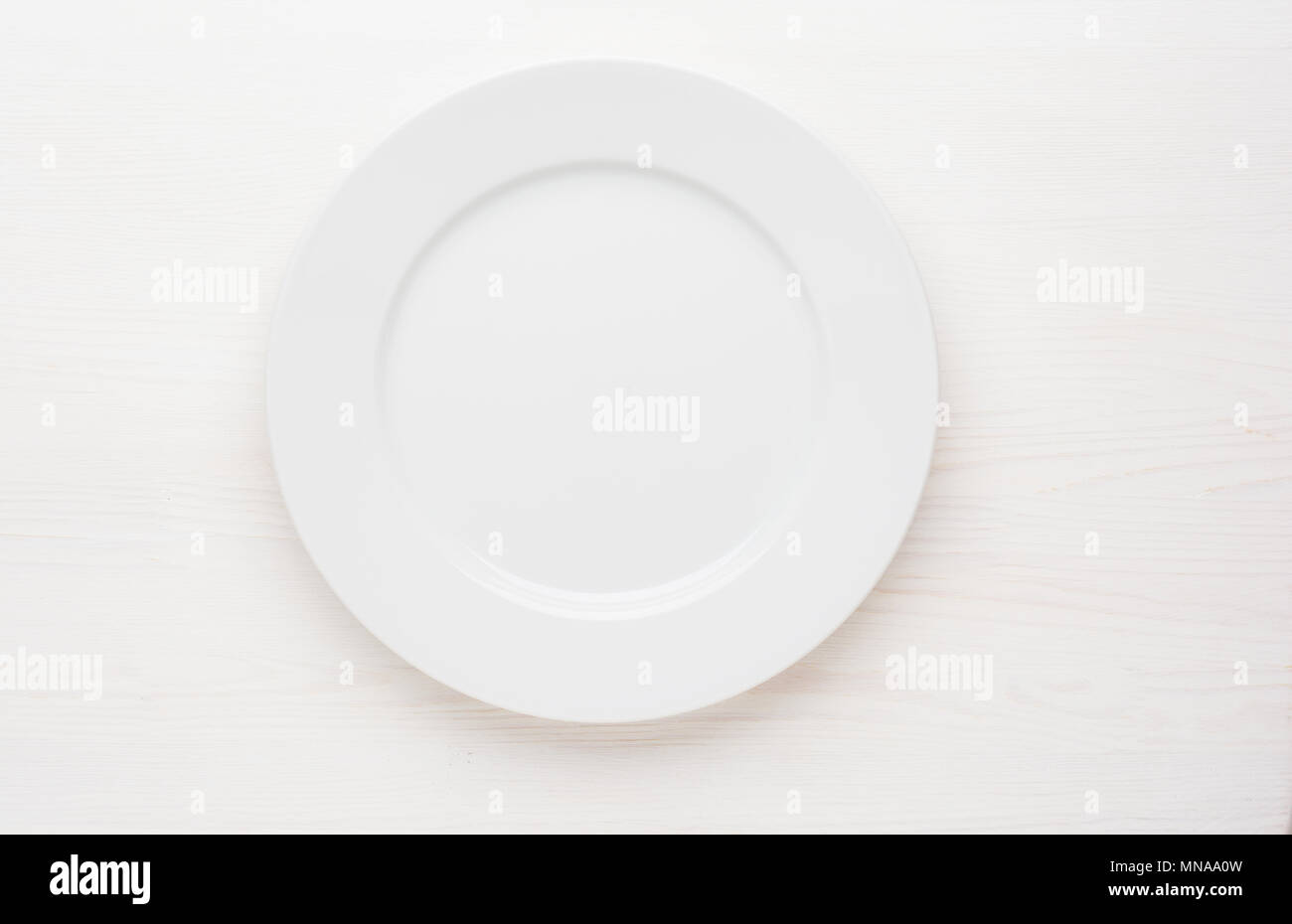 empty white plate on white background top view Stock Photo - Alamy