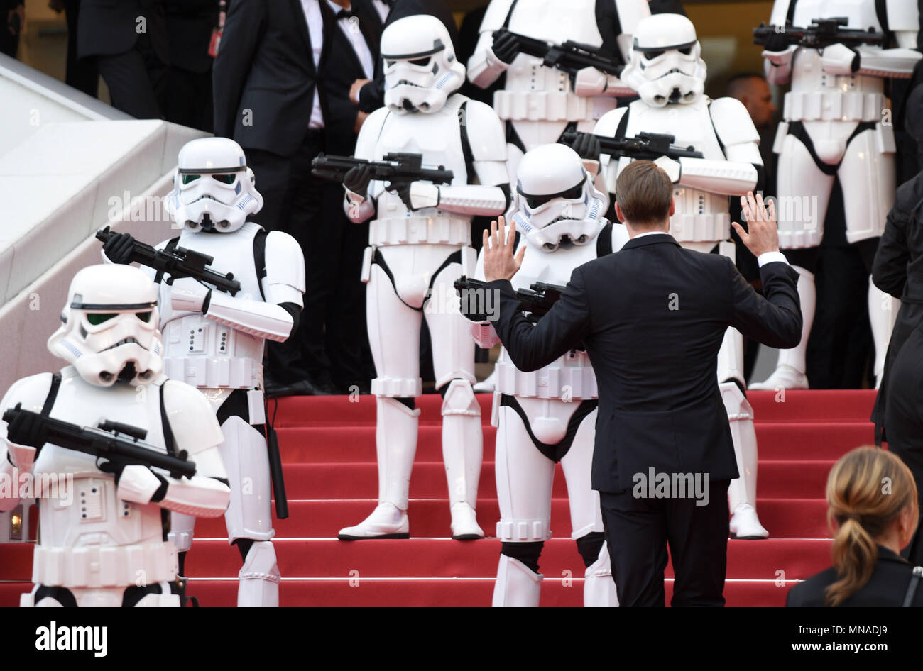 Cannes, France. May 15, 2018 - Cannes, France: A guest raise his hands ...