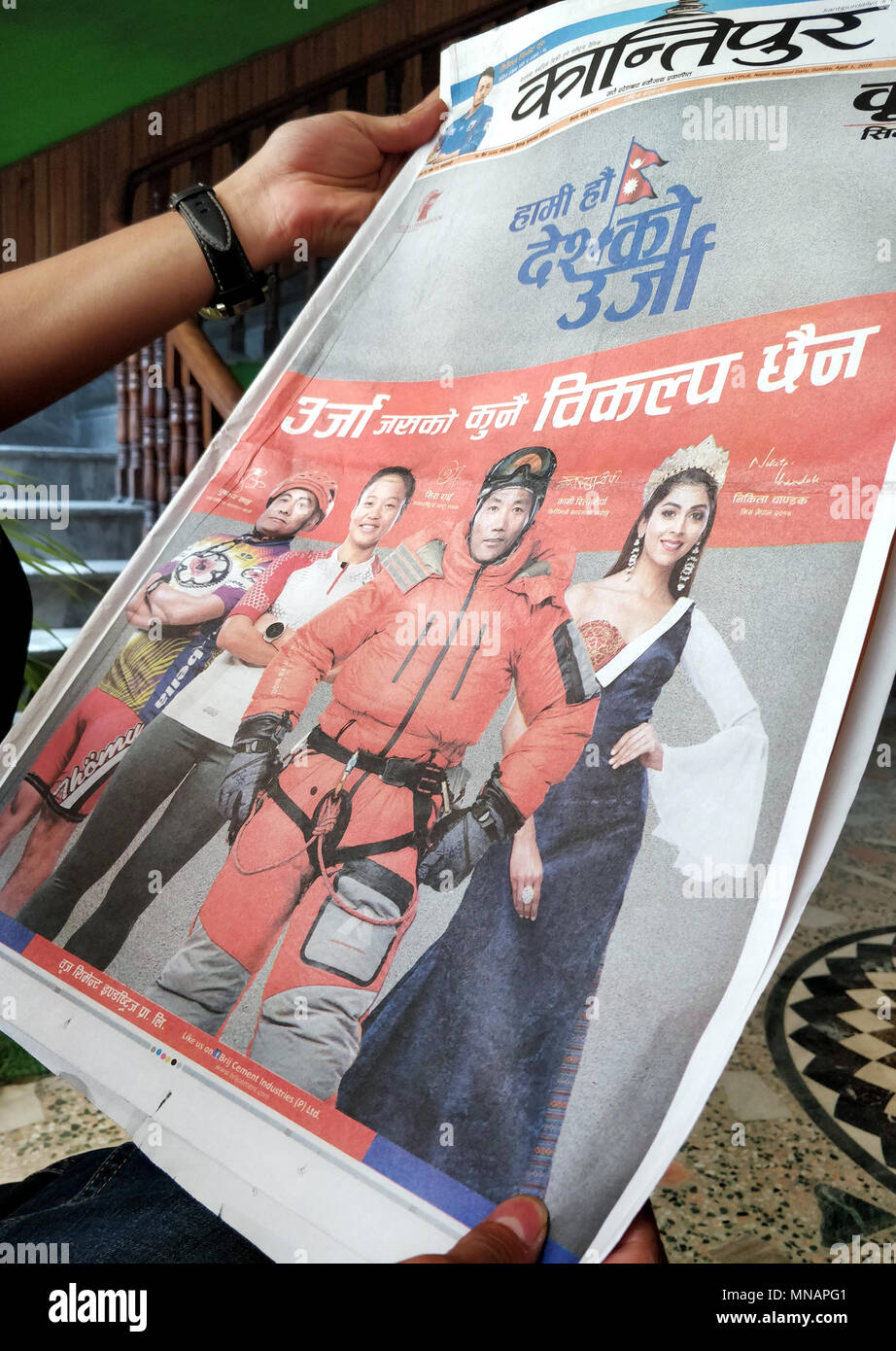 Undated, Nepal, Kathmandu: A man holding an issue of the Kantipur newspaper of the 01 April 2017 with the photo of Kami Rita Sherpa (2-R), who appears in the advertisment of a cement company. Photo: Deepak Adhikari/-/dpa Stock Photo
